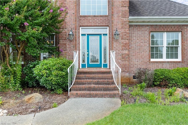 1938 Lancing Crest Ln, Chesapeake, VA 23323 - view of exterior entry featuring a shingled roof and brick siding