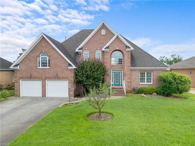 1938 Lancing Crest Ln, Chesapeake, VA 23323 - traditional-style home with brick siding, a garage, asphalt driveway, a front yard, and roof with shingles