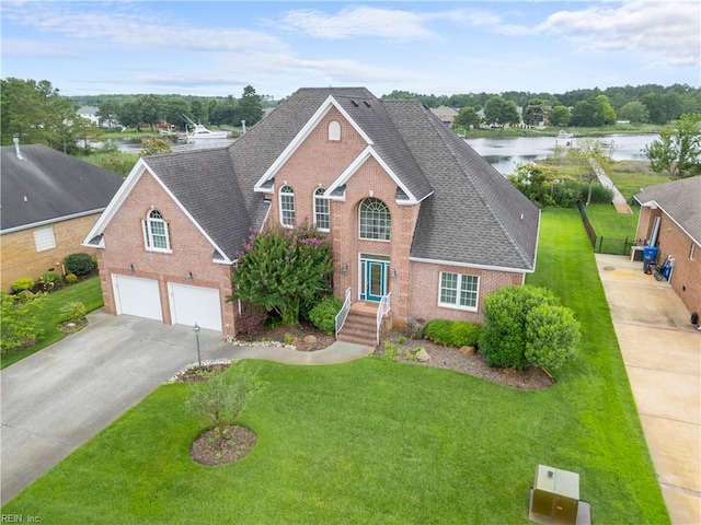 1938 Lancing Crest Ln, Chesapeake, VA 23323 - traditional home with brick siding, a shingled roof, driveway, a garage, and a front yard