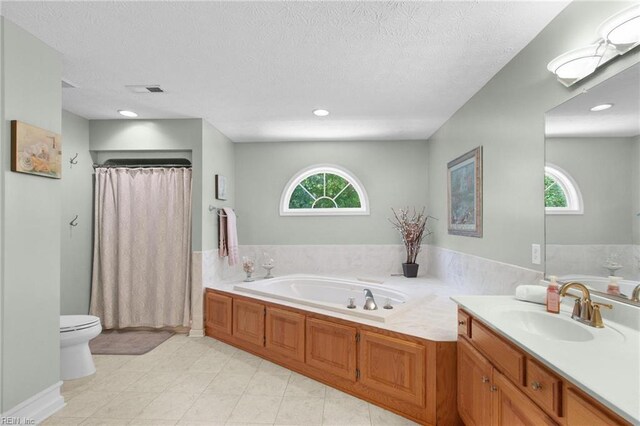 203 Vixen Ct, Yorktown, VA 23693 - bathroom featuring a garden tub, vanity, a textured ceiling, a shower with curtain, and recessed lighting