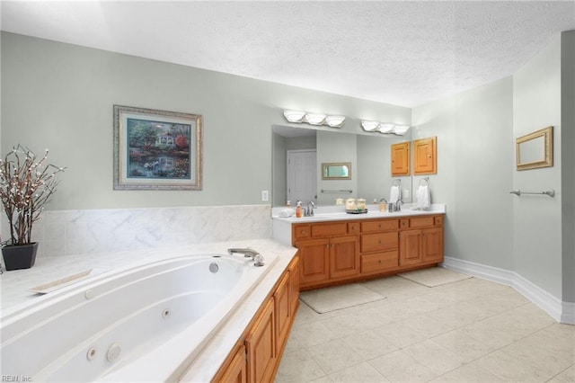 203 Vixen Ct, Yorktown, VA 23693 - bathroom with double vanity, a jetted tub, and a textured ceiling