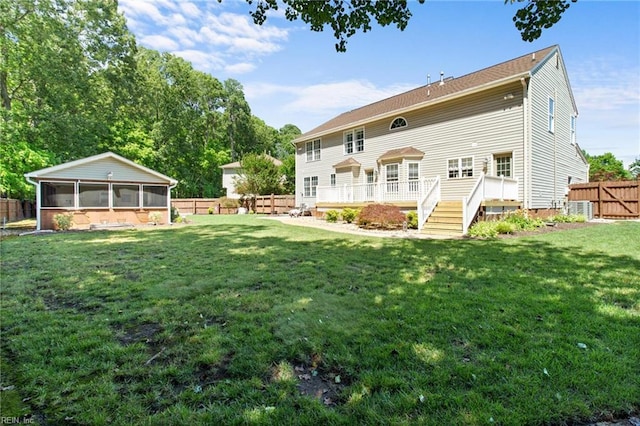 203 Vixen Ct, Yorktown, VA 23693 - rear view of house featuring a sunroom and a wooden deck