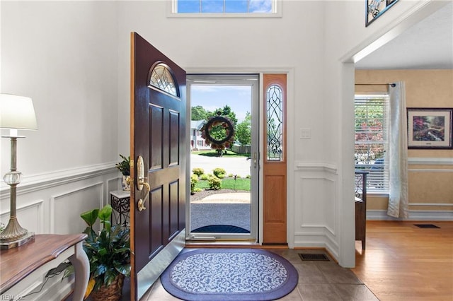 203 Vixen Ct, Yorktown, VA 23693 - entrance foyer with a decorative wall, a wainscoted wall, and tile patterned flooring