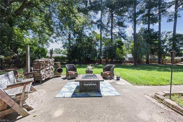 205 Ridgeland Dr, Smithfield, VA 23430 - fenced backyard with a fire pit and a patio area