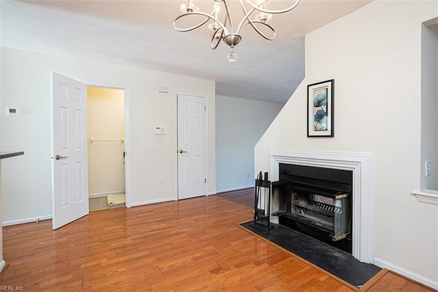 751 S Lake Cir, Chesapeake, VA 23322 - living room with wood finished floors, a chandelier, and a fireplace with flush hearth