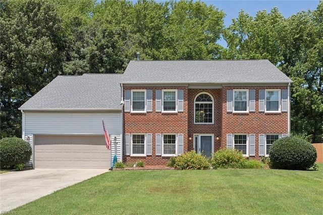 104 Hounds Chase Chase, Yorktown, VA 23693 - colonial-style house with a garage, concrete driveway, a front lawn, brick siding, and a shingled roof