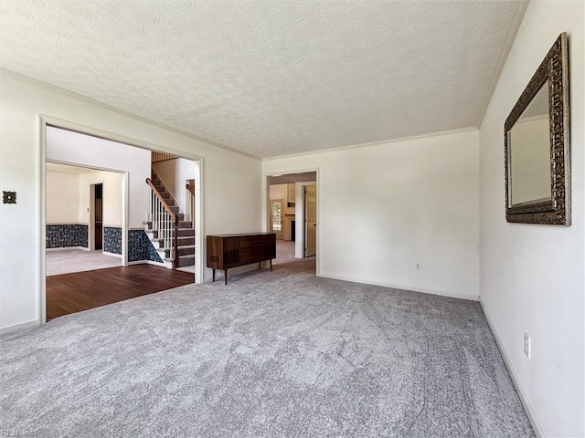 104 Hounds Chase Chase, Yorktown, VA 23693 - spare room featuring carpet floors, stairs, and a textured ceiling