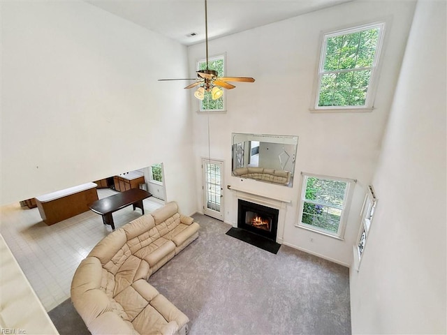 104 Hounds Chase Chase, Yorktown, VA 23693 - carpeted living area with healthy amount of natural light, ceiling fan, a fireplace with flush hearth, and a high ceiling