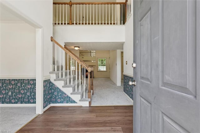 104 Hounds Chase Chase, Yorktown, VA 23693 - carpeted entryway featuring wood finished floors, stairway, and wallpapered walls
