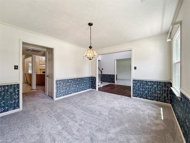 104 Hounds Chase Chase, Yorktown, VA 23693 - carpeted empty room featuring wallpapered walls, a wainscoted wall, crown molding, stairs, and a textured ceiling