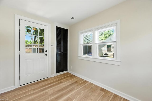 704 73rd St, Newport News, VA 23605 - entryway featuring healthy amount of natural light and light wood-style flooring