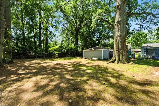 704 73rd St, Newport News, VA 23605 - view of yard with a trampoline and an outbuilding