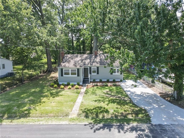 704 73rd St, Newport News, VA 23605 - view of front facade with a chimney, driveway, and a shingled roof