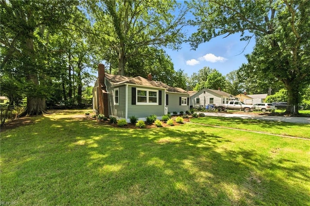 704 73rd St, Newport News, VA 23605 - view of front of house with a chimney, a front lawn, and driveway