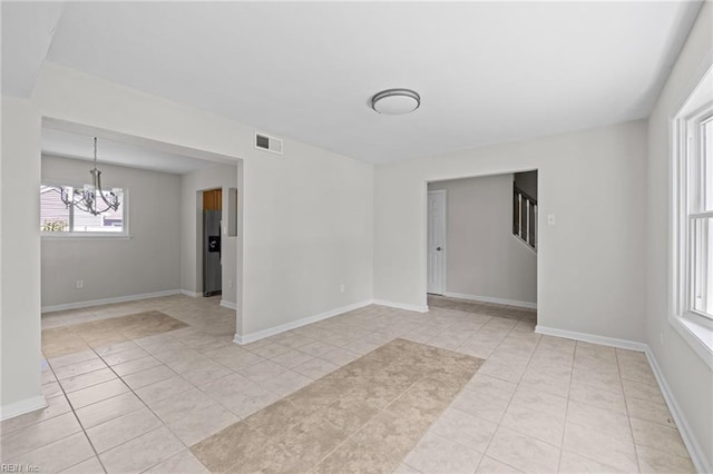 3012 Camelot Blvd, Chesapeake, VA 23323 - unfurnished room featuring a chandelier, light tile patterned floors, and stairs