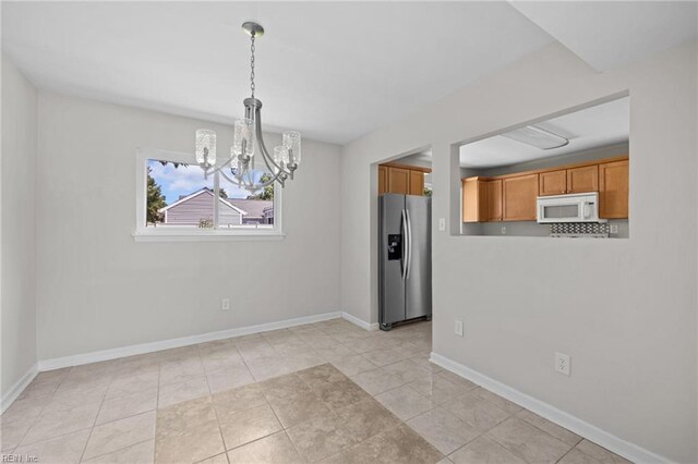 3012 Camelot Blvd, Chesapeake, VA 23323 - unfurnished dining area with a chandelier and light tile patterned floors