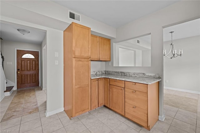 3012 Camelot Blvd, Chesapeake, VA 23323 - kitchen with a chandelier and light tile patterned floors