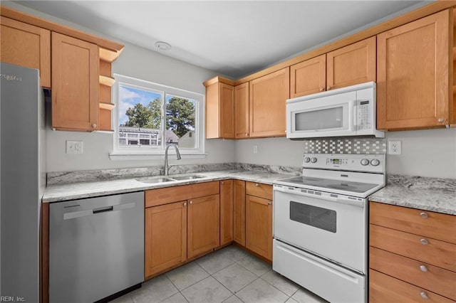 3012 Camelot Blvd, Chesapeake, VA 23323 - kitchen with stainless steel appliances, light tile patterned flooring, open shelves, and light stone countertops