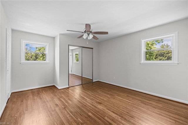 3012 Camelot Blvd, Chesapeake, VA 23323 - unfurnished bedroom featuring wood finished floors, ceiling fan, and a closet