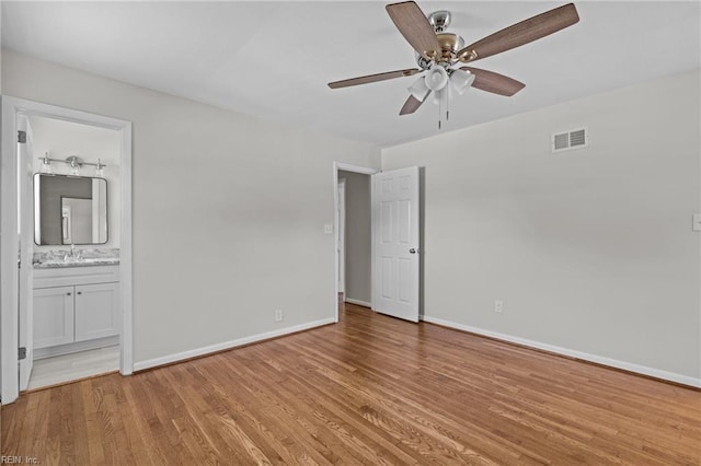3012 Camelot Blvd, Chesapeake, VA 23323 - unfurnished bedroom featuring light wood-type flooring, connected bathroom, and a ceiling fan