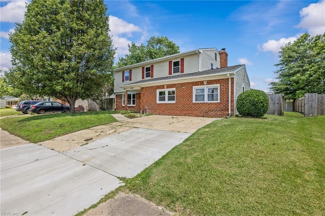 3012 Camelot Blvd, Chesapeake, VA 23323 - traditional-style home with driveway, brick siding, and a chimney