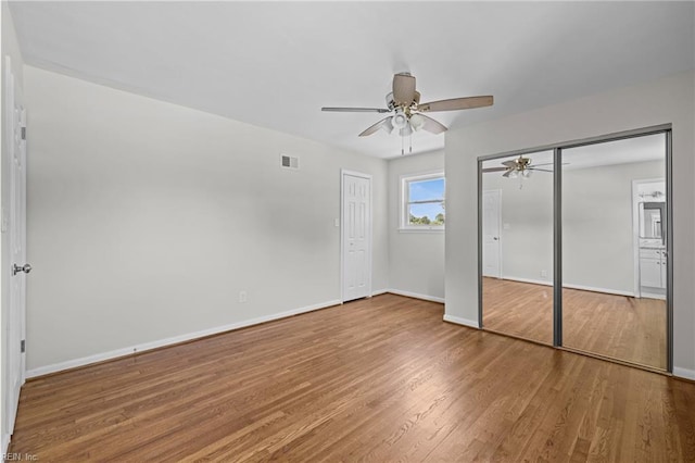 3012 Camelot Blvd, Chesapeake, VA 23323 - unfurnished bedroom featuring wood finished floors, two closets, and ceiling fan