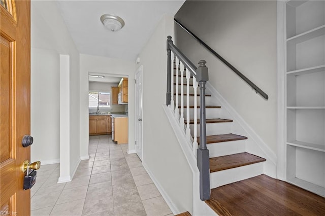 3012 Camelot Blvd, Chesapeake, VA 23323 - staircase with built in shelves and tile patterned flooring
