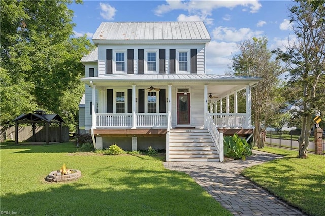 515 Beach Rd, Hampton, VA 23664 - view of front of house with a ceiling fan, covered porch, an outdoor fire pit, a front yard, and stairs