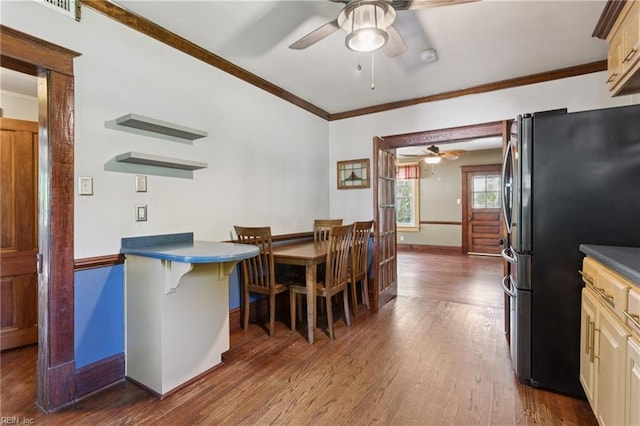 515 Beach Rd, Hampton, VA 23664 - dining area featuring ceiling fan, dark wood-type flooring, and ornamental molding