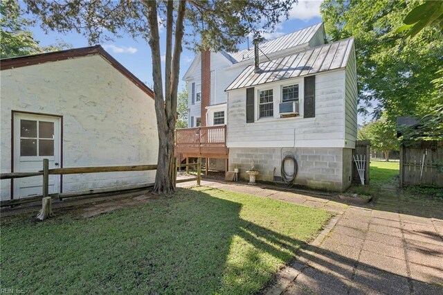 515 Beach Rd, Hampton, VA 23664 - view of side of home featuring a deck, a metal roof, a standing seam roof, and cooling unit