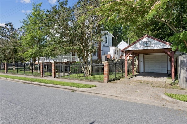 515 Beach Rd, Hampton, VA 23664 - view of front of property with a detached garage, driveway, and an outdoor structure