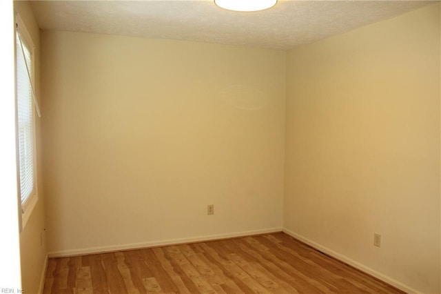 27 Sally Ann Pl, Newport News, VA 23602 - empty room with light wood-style floors, plenty of natural light, and a textured ceiling