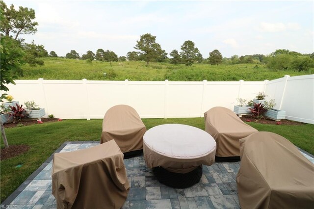 1815 Honey Milk Rd, Chesapeake, VA 23323 - fenced backyard featuring a patio area