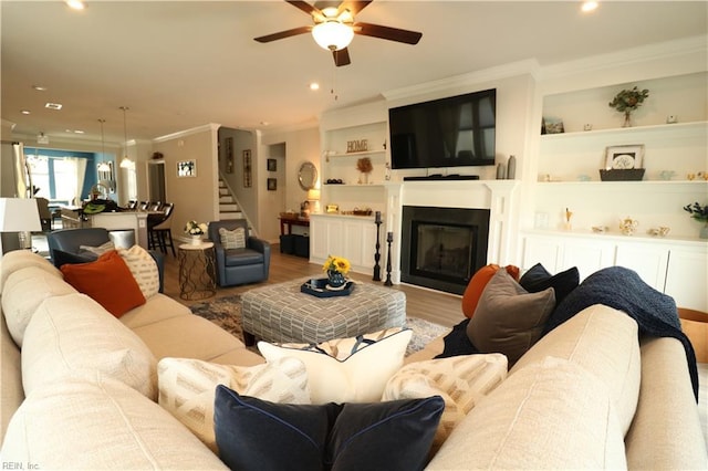 1815 Honey Milk Rd, Chesapeake, VA 23323 - living area featuring stairway, ceiling fan, crown molding, wood finished floors, and recessed lighting