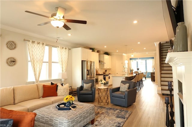 1815 Honey Milk Rd, Chesapeake, VA 23323 - living area with a fireplace, ornamental molding, ceiling fan, light wood-type flooring, and recessed lighting