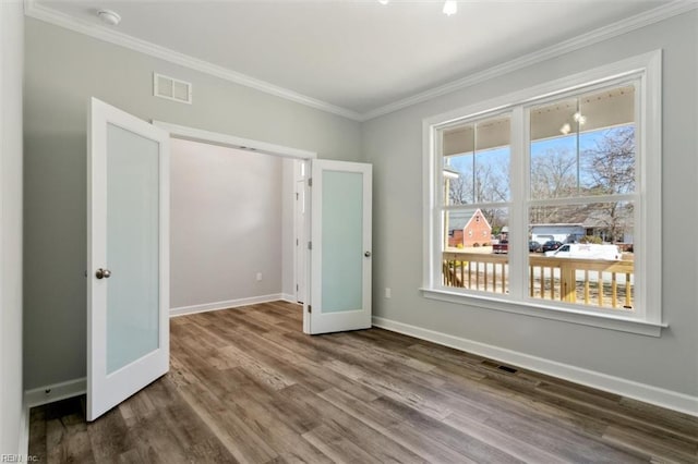 461 Joy Dr, Hampton, VA 23666 - unfurnished bedroom featuring crown molding and wood finished floors