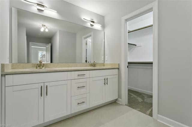 461 Joy Dr, Hampton, VA 23666 - bathroom with double vanity and a walk in closet