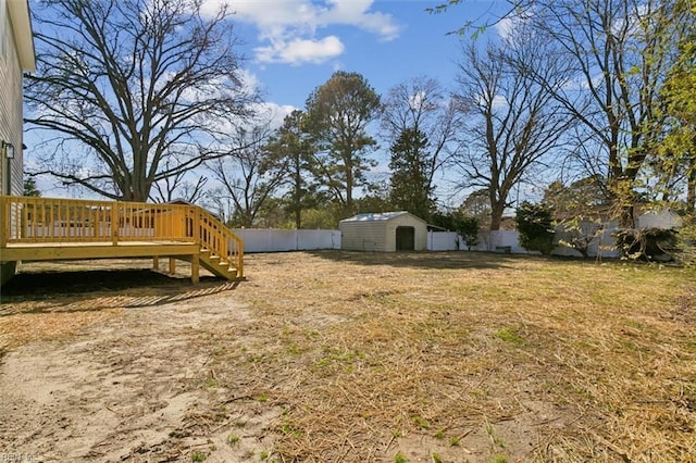 461 Joy Dr, Hampton, VA 23666 - fenced backyard featuring a deck, a storage unit, and stairway