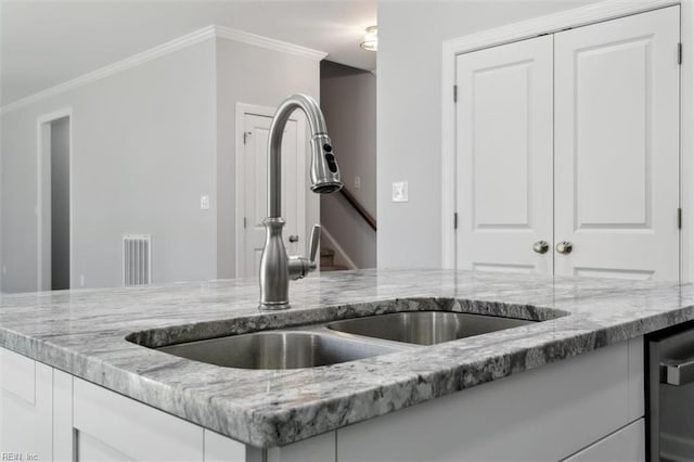 461 Joy Dr, Hampton, VA 23666 - kitchen featuring light stone countertops, ornamental molding, white cabinetry, and dishwasher