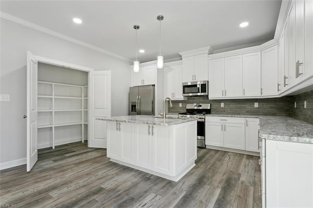 461 Joy Dr, Hampton, VA 23666 - kitchen with appliances with stainless steel finishes, dark wood-type flooring, ornamental molding, decorative backsplash, and white cabinetry