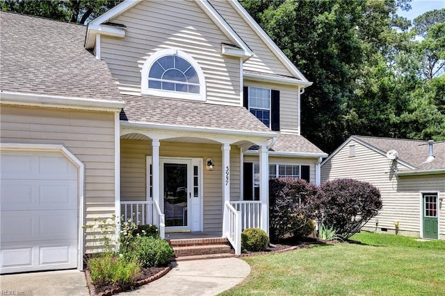3957 Driftwood Way, Williamsburg, VA 23188 - traditional-style home with covered porch, a shingled roof, an attached garage, and a front lawn