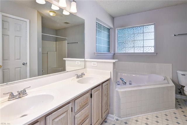 3957 Driftwood Way, Williamsburg, VA 23188 - full bathroom with a bath, double vanity, a shower, a textured ceiling, and tile patterned floors