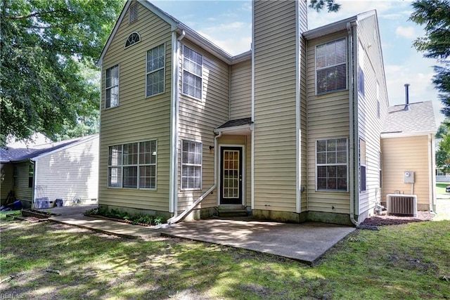 3957 Driftwood Way, Williamsburg, VA 23188 - rear view of property with a chimney, entry steps, a patio, and a lawn