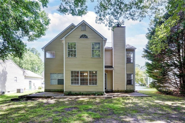 3957 Driftwood Way, Williamsburg, VA 23188 - rear view of house featuring a chimney, a patio, and a lawn