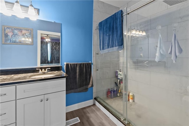 57 Locust Ave, Hampton, VA 23661 - full bathroom featuring a shower stall, vanity, and wood finished floors