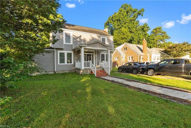 57 Locust Ave, Hampton, VA 23661 - view of front of home with a front lawn and a chimney