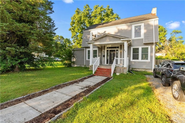 57 Locust Ave, Hampton, VA 23661 - view of front of property with a front yard and a chimney