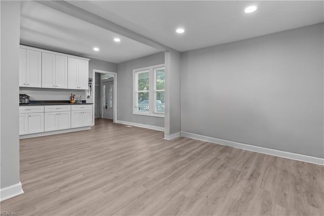 57 Locust Ave, Hampton, VA 23661 - kitchen featuring dark countertops, light wood-style floors, white cabinetry, and recessed lighting