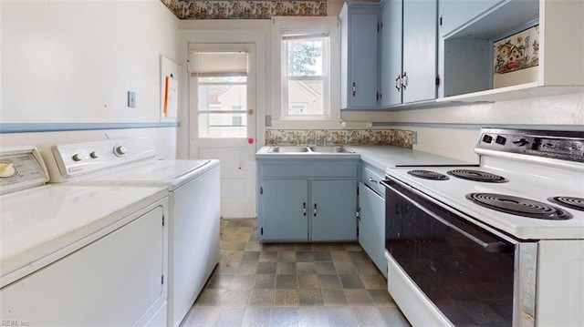 1324 Wilroy Rd, Suffolk, VA 23434 - kitchen with white electric range, washer and dryer, light countertops, and blue cabinetry