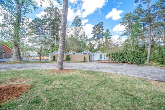 1320 Clay St, Franklin, VA 23851 - view of front of home featuring a front lawn and asphalt driveway